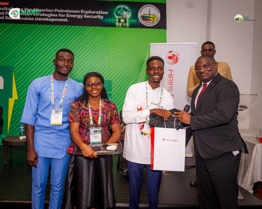 A winning team receiving their award on stage